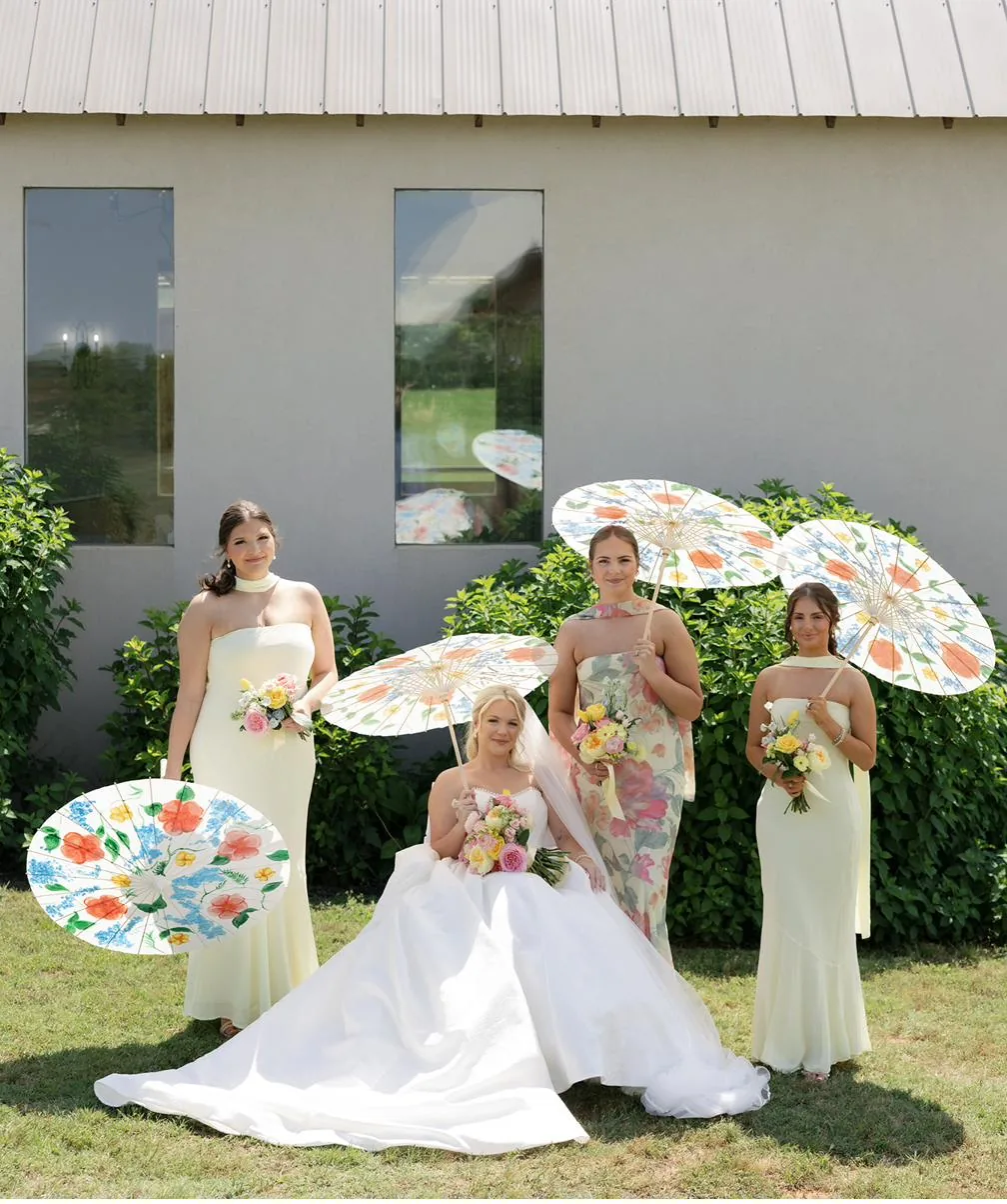 Bailey and her bridesmaids with second line parasols at Gateley Hill Gardens