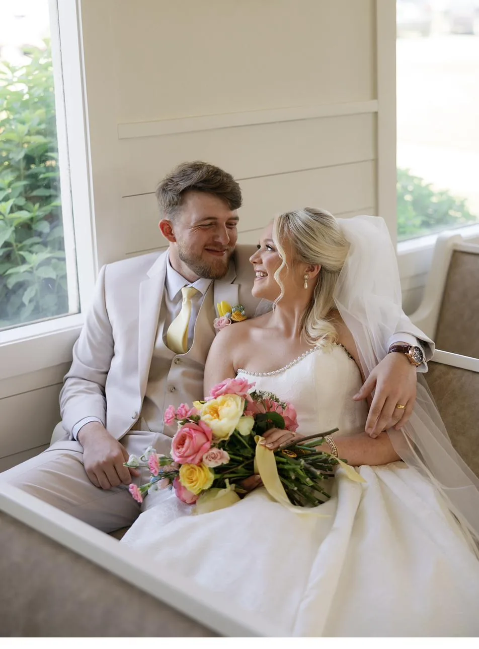 Bailey and Titus sharing a quiet moment on their wedding day at Gateley Hill Gardens
