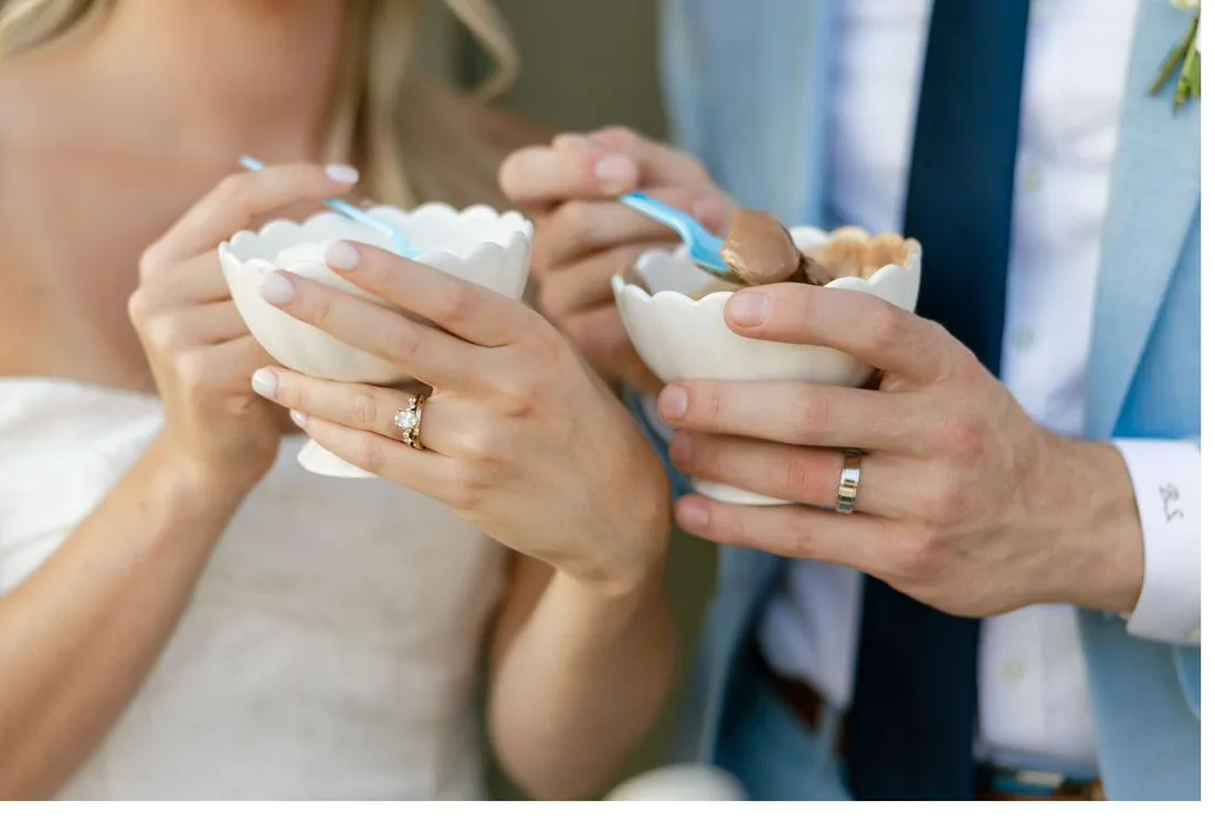 Bride and groom holding bowls of Loblolly ice cream at their Gateley Hill Gardens wedding