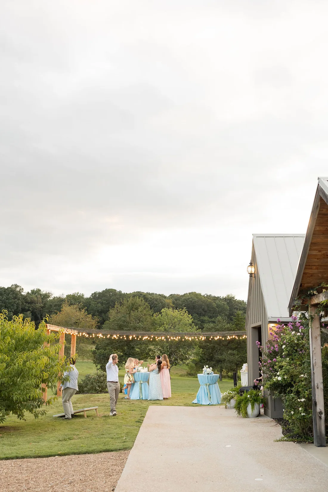 Guests gathering under string lights for the send-off at Gateley Hill Gardens