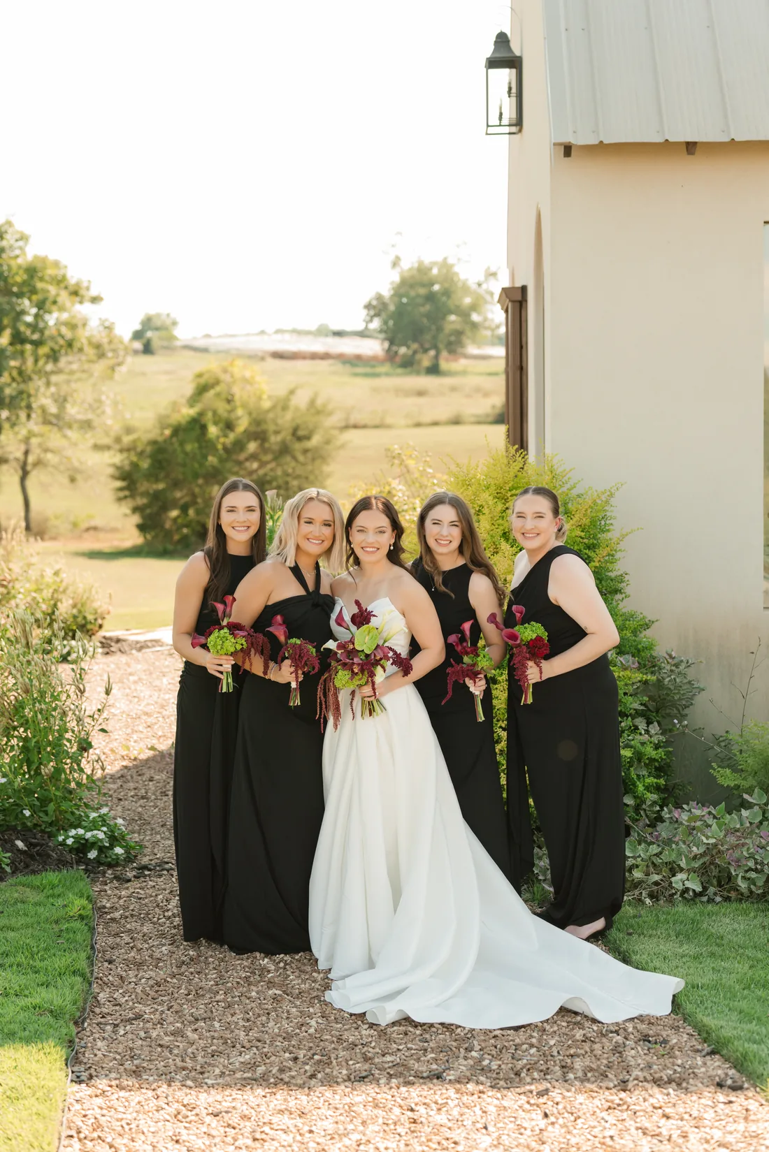 Madisyn and her bridal party in the field at Gateley Hill Gardens