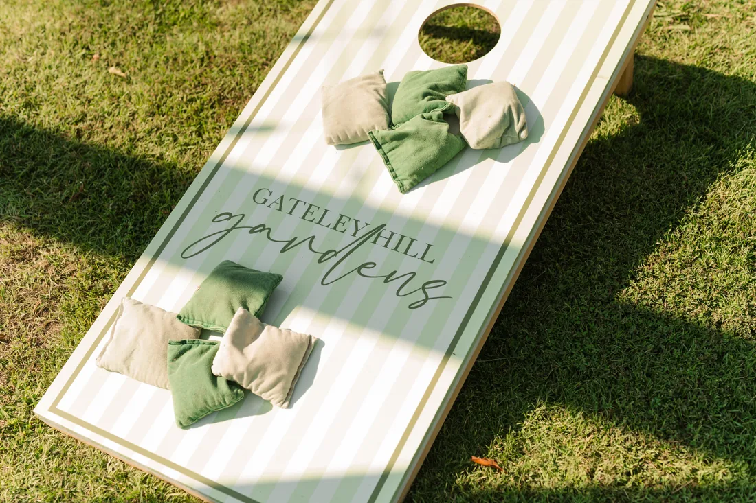 Gateley Hill Gardens cornhole boards with green bags at the reception