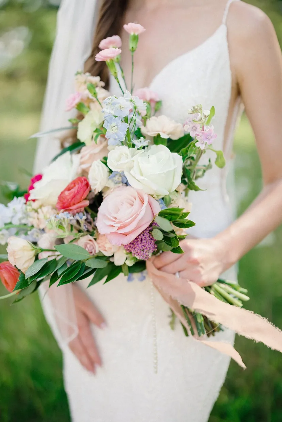 Bride holding a garden bridal bouquet at a Minimony at Gateley Hill Gardens, Dardanelle Arkansas