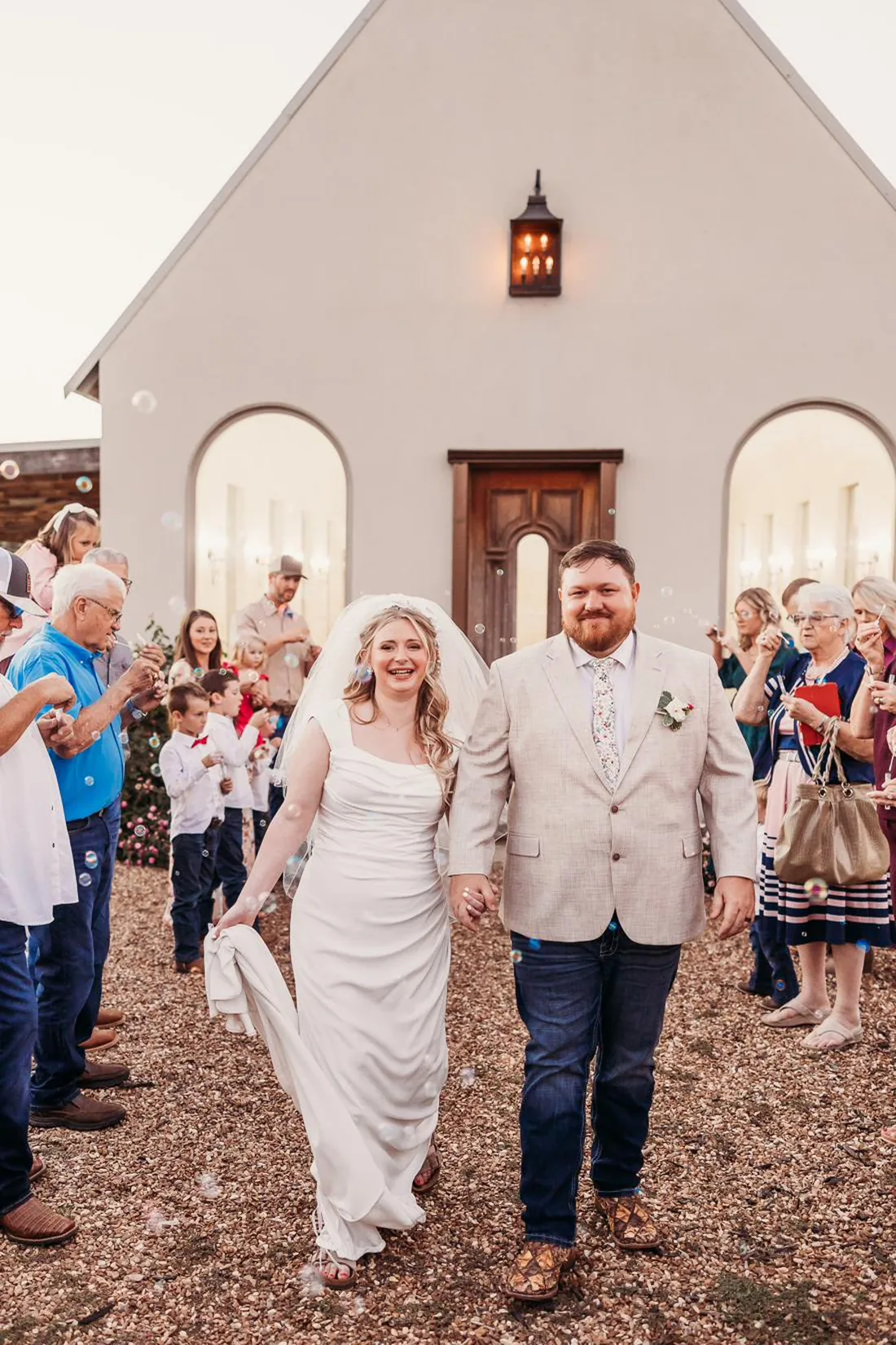 Couple leaving their fall wedding at Gateley Hill Gardens