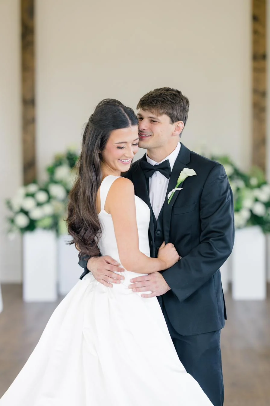 Olivia and Dax in the white stucco chapel at Gateley Hill Gardens